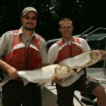 800px-Employees_hold_an_Asian_carp_fish